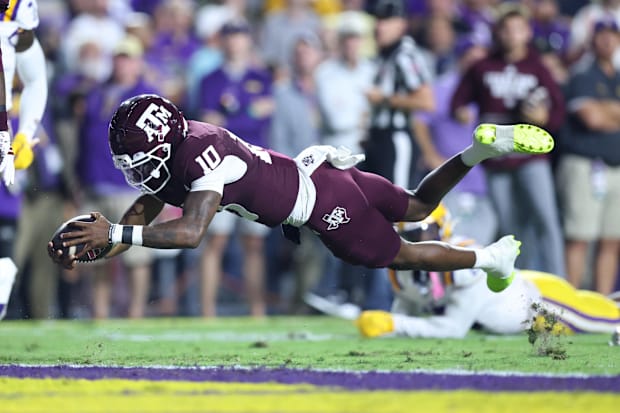 Texas A&M quarterback Marcel Reed dives for a touchdown against LSU.