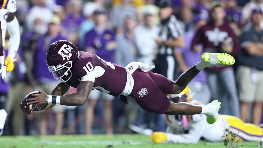 Texas A&M quarterback Marcel Reed dives for a touchdown against LSU.