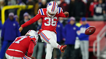 Dec 1, 2025; Foxborough, Massachusetts, USA; New England Patriots place kicker Andy Borregales (36) makes a kick out of the hold from New England Patriots punter Bryce Baringer (17) during the first quarter at Gillette Stadium. Mandatory Credit: David Butler II-Imagn Images