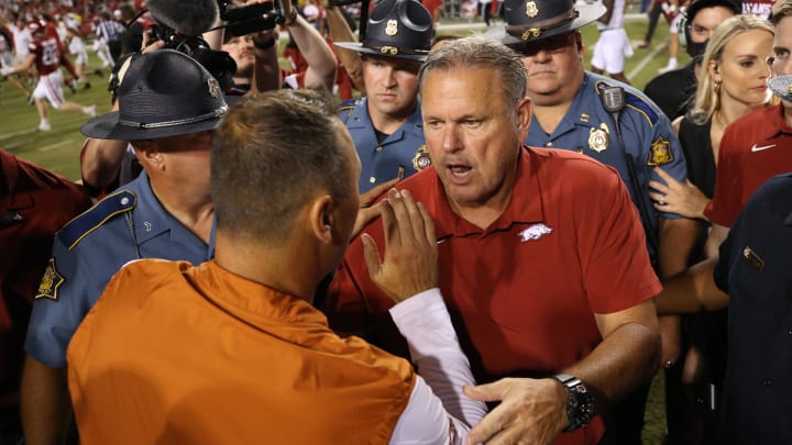 Sep 11, 2021; Fayetteville, Arkansas, USA; Arkansas Razorbacks head coach Sam Pittman talks to Texas Longhorns head coach Steve Sarkisian after the game at Donald W. Reynolds Razorback Stadium. Arkansas won 40-21. Mandatory Credit: Nelson Chenault-USA TODAY Sports