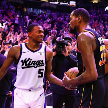 Jan 16, 2024; Phoenix, Arizona, USA; Phoenix Suns forward Kevin Durant (35) greets Sacramento Kings guard De'Aaron Fox (5) following the Suns 119-117 victory at Footprint Center. Mandatory Credit: Mark J. Rebilas-Imagn Images