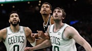 Jan 17, 2024; Boston, Massachusetts, USA; Boston Celtics forward Jayson Tatum (0) and center Luke Kornet (40) box out San Antonio Spurs center Victor Wembanyama (1) during the second half at TD Garden. Mandatory Credit: Winslow Townson-Imagn Images
