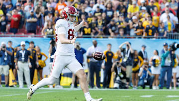 Dec 31, 2024; Tampa, FL, USA; Alabama Crimson Tide punter James Burnip (86) punts the ball against the Michigan Wolverines during the first half at Raymond James Stadium. Mandatory Credit: Matt Pendleton-Imagn Images