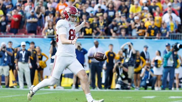 Dec 31, 2024; Tampa, FL, USA; Alabama Crimson Tide punter James Burnip (86) punts the ball against the Michigan Wolverines during the first half at Raymond James Stadium. Mandatory Credit: Matt Pendleton-Imagn Images Dec 31, 2024; Tampa, FL, USA; Alabama Crimson Tide punter James Burnip (86) punts the ball against the Michigan Wolverines during the first half at Raymond James Stadium. Mandatory Credit: Matt Pendleton-Imagn Images