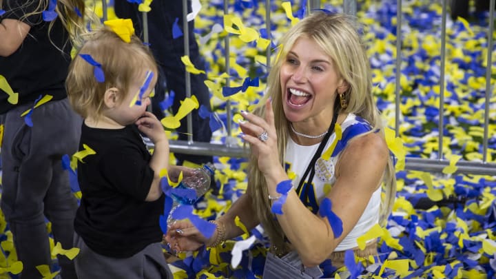 Feb 13, 2022; Inglewood, CA, USA; Kelly Stafford, wife of Los Angeles Rams quarterback Matthew Stafford (not pictured) plays with their daughters in the confetti as they celebrate after defeating the Cincinnati Bengals during Super Bowl LVI at SoFi Stadium. Mandatory Credit: Mark J. Rebilas-USA TODAY Sports