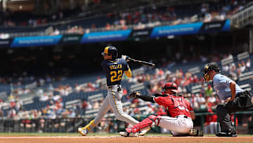 Aug 3, 2025; Washington, District of Columbia, USA; Milwaukee Brewers outfielder Christian Yelich (22) hits an RBI single against the Washington Nationals during the first inning at Nationals Park. Mandatory Credit: Geoff Burke-Imagn Images