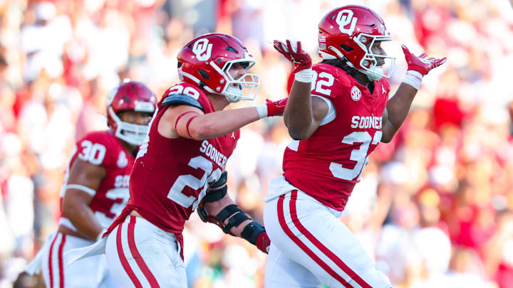 Sep 14, 2024; Norman, Oklahoma, USA; Oklahoma Sooners defensive lineman R Mason Thomas (32) celebrates with Oklahoma Sooners linebacker Danny Stutsman (28) during the second half against the Tulane Green Wave at Gaylord Family-Oklahoma Memorial Stadium. 