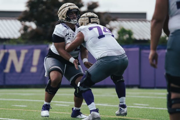 D'Angalo Titialii and Drew Azzopardi, transfers from Portland State and San Diego State, respectively, go through a UW blocki