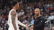 Oct 29, 2025; Toronto, Ontario, CAN; Houston Rockets head coach Ime Udoka congratulates forward Jabari Smith (10) after a play against the Toronto Raptors during the first half at Scotiabank Arena. Mandatory Credit: John E. Sokolowski-Imagn Images