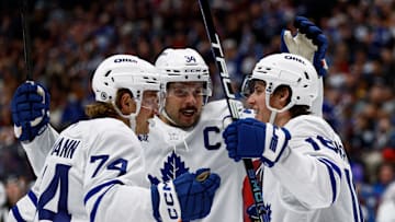 Mar 8, 2025; Denver, Colorado, USA; Toronto Maple Leafs right wing Mitch Marner (16) celebrates his goal with center Bobby McMann (74) and center Auston Matthews (34) in the first period against the Colorado Avalanche at Ball Arena. Mandatory Credit: Isaiah J. Downing-Imagn Images