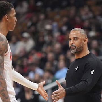 Oct 29, 2025; Toronto, Ontario, CAN; Houston Rockets head coach Ime Udoka congratulates forward Jabari Smith (10) after a play against the Toronto Raptors during the first half at Scotiabank Arena. Mandatory Credit: John E. Sokolowski-Imagn Images