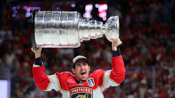 Jun 17, 2025; Sunrise, Florida, USA; Florida Panthers left wing Tomas Nosek (92) hoists the Stanley Cup after winning game six of the 2025 Stanley Cup Final against the Edmonton Oilers at Amerant Bank Arena. Jun 17, 2025; Sunrise, Florida, USA; Florida Panthers left wing Tomas Nosek (92) hoists the Stanley Cup after winning game six of the 2025 Stanley Cup Final against the Edmonton Oilers at Amerant Bank Arena.