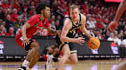 Purdue guard Fletcher Loyer (2) is guarded by Rutgers guard Jamichael Davis (1) 