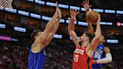 Nov 3, 2025; Houston, Texas, USA; Houston Rockets center Alperen Sengun (28) dunks against Dallas Mavericks forward Dwight Powell (7) in the second quarter at Toyota Center. Mandatory Credit: Thomas Shea-Imagn Images