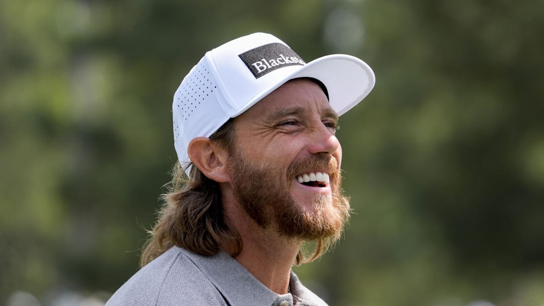 Tommy Fleetwood smiles on the second hole