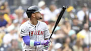 Sep 28, 2025; San Diego, California, USA; Arizona Diamondbacks second baseman Ketel Marte (4) hits a solo home run during the first inning against the San Diego Padres at Petco Park. Mandatory Credit: Denis Poroy-Imagn Images