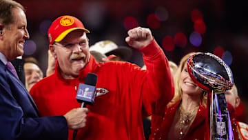 Feb 11, 2024; Paradise, Nevada, USA; Kansas City Chiefs head coach Andy Reid celebrates with the Vince Lombardi Trophy after defeating the San Francisco 49ers in Super Bowl LVIII at Allegiant Stadium. Mandatory Credit: Mark J. Rebilas-Imagn Images