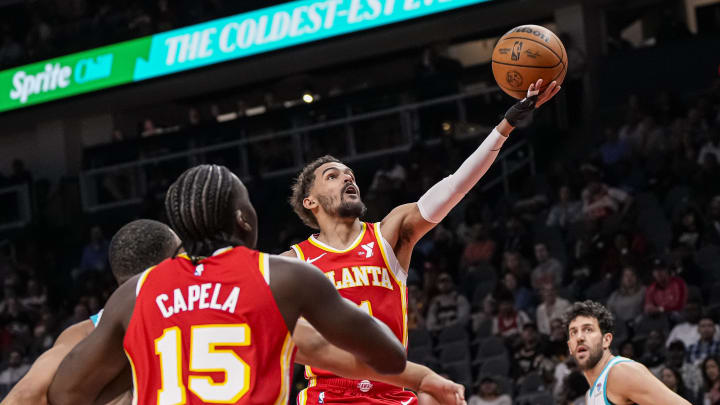 Apr 10, 2024; Atlanta, Georgia, USA; Atlanta Hawks guard Trae Young (11) goes to the basket against the Charlotte Hornets during the first half at State Farm Arena. Mandatory Credit: Dale Zanine-USA TODAY Sports