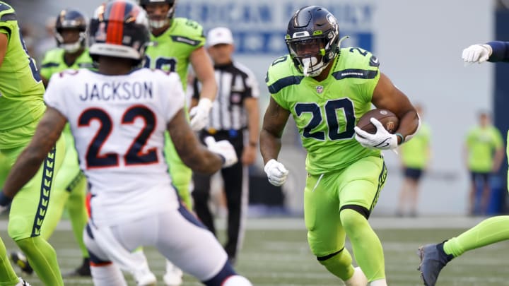 Sep 12, 2022; Seattle, Washington, USA; Seattle Seahawks running back Rashaad Penny (20) rushes against the Denver Broncos during the first quarter at Lumen Field. Mandatory Credit: Joe Nicholson-USA TODAY Sports