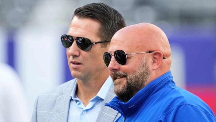 Aug 26, 2023; East Rutherford, New Jersey, USA; New York Giants head coach Brian Daboll (right) and general manager Joe Schoen (left) talk before a game against the New York Jets at MetLife Stadium. Mandatory Credit: Robert Deutsch-Imagn Images