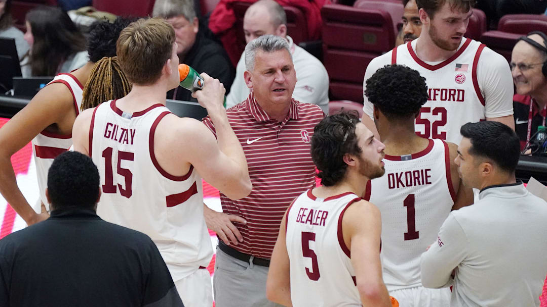 Dec 7, 2025; Stanford, California, USA;  Stanford Cardinal head coach Kyle Smith talks with forward/center Oskar Giltay (15), guard Benny Gealer (5), guard Ebuka Okorie (1), and forward/center Aidan Cammann (52) during a break in the action in the second half against the UNLV Runnin' Rebels at Maples Pavilion. Mandatory Credit: David Gonzales-Imagn Images