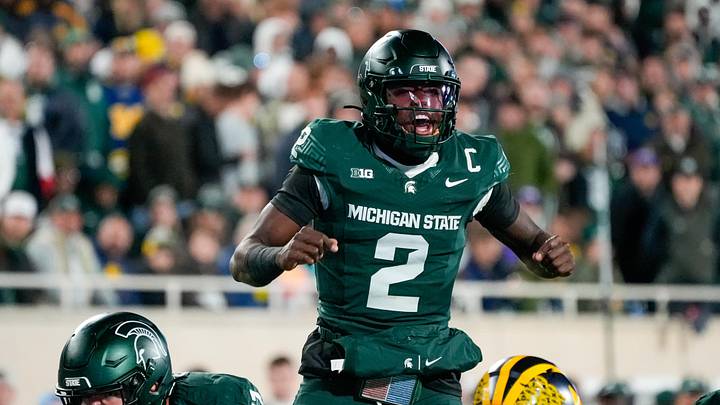 Oct 25, 2025; East Lansing, Michigan, USA; Michigan State Spartans quarterback Aidan Chiles (2) calls a play at the line of scrimmage against the Michigan Wolverines during the first half at Spartan Stadium. Mandatory Credit: Brendan Mullin-Imagn Images