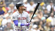 Sep 28, 2025; San Diego, California, USA; Arizona Diamondbacks second baseman Ketel Marte (4) hits a solo home run during the first inning against the San Diego Padres at Petco Park. Mandatory Credit: Denis Poroy-Imagn Images