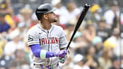 Sep 28, 2025; San Diego, California, USA; Arizona Diamondbacks second baseman Ketel Marte (4) hits a solo home run during the first inning against the San Diego Padres at Petco Park. Mandatory Credit: Denis Poroy-Imagn Images