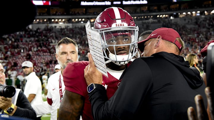 Alabama Crimson Tide head coach Kalen DeBoer gives some encouragement to quarterback Jalen Milroe (4) at Bryant-Denny Stadium after defeating the South Florida Bulls. 