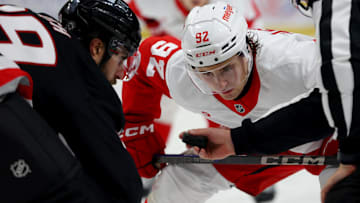 Oct 26, 2024; Buffalo, New York, USA;  Detroit Red Wings center Marco Kasper (92) waits for the linesman to drop the puck for a face-off against Buffalo Sabres right wing Alex Tuch (89) during the third period at KeyBank Center. Mandatory Credit: Timothy T. Ludwig-Imagn Images