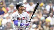 Sep 28, 2025; San Diego, California, USA; Arizona Diamondbacks second baseman Ketel Marte (4) hits a solo home run during the first inning against the San Diego Padres at Petco Park. Mandatory Credit: Denis Poroy-Imagn Images