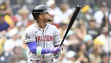 Sep 28, 2025; San Diego, California, USA; Arizona Diamondbacks second baseman Ketel Marte (4) hits a solo home run during the first inning against the San Diego Padres at Petco Park. Mandatory Credit: Denis Poroy-Imagn Images