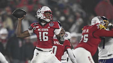 Dec 28, 2024; Annapolis, MD, USA;  North Carolina State Wolfpack quarterback CJ Bailey (16) throws from the pocket during the first half of the the Go Bowling Military Bowl against the East Carolina Pirates at Navy-Marine Corps Memorial Stadium. Mandatory Credit: Tommy Gilligan-Imagn Images