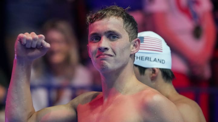Carson Foster celebrates after winning the 400-meter individual medley final Sunday, June 16, 2024, during the second day of competition for the U.S. Olympic Team Swimming Trials at Lucas Oil Stadium in Indianapolis.