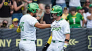 Oregon outfielder Mason Neville, right, celebrates a home run with infielder Dominic Hellman as the Oregon Ducks host the Washington Huskies on May 10, 2025, at PK Park in Eugene.