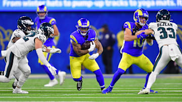 Nov 24, 2024; Inglewood, California, USA; Los Angeles Rams running back Blake Corum (22) runs the ball against the Philadelphia Eagles during the second half at SoFi Stadium. Mandatory Credit: Gary A. Vasquez-Imagn Images