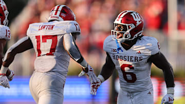 Ty Son Lawton #17 of the Indiana Hoosiers celebrates a touchdown with Justice Ellison #6 against the Northwestern Wildcats during the second half at Martin Stadium on October 05, 2024 in Evanston, Illinois.