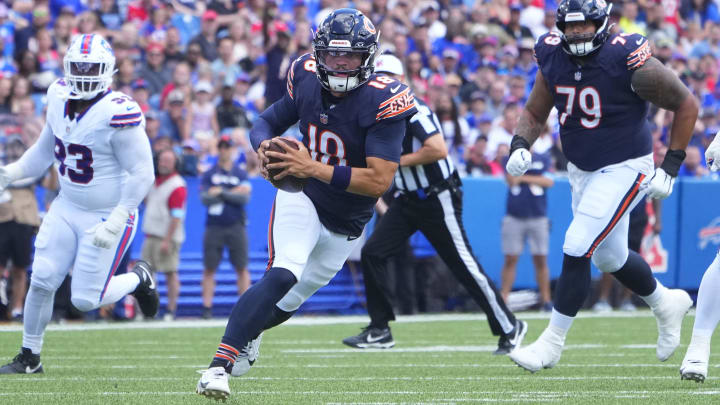 Aug 10, 2024; Orchard Park, New York, USA; Chicago Bears quarterback Caleb Williams (18) runs with the ball against the Buffalo Bills during the first half at Highmark Stadium. Mandatory Credit: Gregory Fisher-USA TODAY Sports