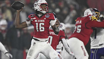 Dec 28, 2024; Annapolis, MD, USA;  North Carolina State Wolfpack quarterback CJ Bailey (16) throws from the pocket during the first half of the the Go Bowling Military Bowl against the East Carolina Pirates at Navy-Marine Corps Memorial Stadium. Mandatory Credit: Tommy Gilligan-Imagn Images