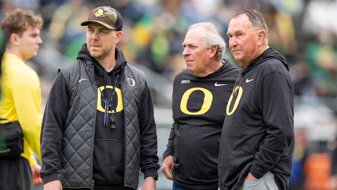 Oregon offensive coordinator Will Stein, left, former Oregon defensive coordinator Nick Aliotti and former Oregon coach Rich Brooks talk before the game as the Fighting Ducks face off against Mighty Oregon in the Oregon Ducks spring game on April 26, 2025, at Autzen Stadium in Eugene. Oregon offensive coordinator Will Stein, left, former Oregon defensive coordinator Nick Aliotti and former Oregon coach Rich Brooks talk before the game as the Fighting Ducks face off against Mighty Oregon in the Oregon Ducks spring game on April 26, 2025, at Autzen Stadium in Eugene.