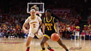Dec 10, 2025; Ames, Iowa, USA;  Iowa State Cyclones Arianna Jackson (2) defends Iowa Hawkeyes Chazadi 'chit-Chat' Wright (11) during the second half at James H. Hilton Coliseum. Mandatory Credit: Reese Strickland-Imagn Images