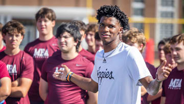 Former MBA quarterback and current Texas A&M starter Marcel Reed speaks at the start of a kids’ football camp held at MBA Saturday, July 12, 2025.