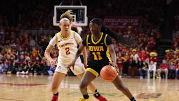 Dec 10, 2025; Ames, Iowa, USA;  Iowa State Cyclones Arianna Jackson (2) defends Iowa Hawkeyes Chazadi 'chit-Chat' Wright (11) during the second half at James H. Hilton Coliseum. Mandatory Credit: Reese Strickland-Imagn Images