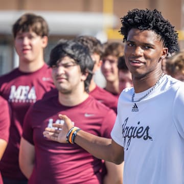 Former MBA quarterback and current Texas A&M starter Marcel Reed speaks at the start of a kids’ football camp held at MBA Saturday, July 12, 2025.