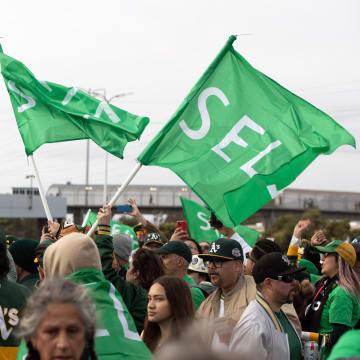 Mar 28, 2024; Oakland, California, USA; Oakland Athletics fans wave “Sell” flags to protest ownership plans to move to the franchise to Las Vegas, before a game between the Athletics and Cleveland Guardians at Oakland-Alameda County Coliseum. Mandatory Credit: D. Ross Cameron-USA TODAY Sports