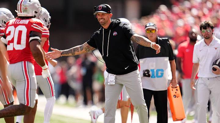 Ohio State Buckeyes linebackers coach James Laurinaitis celebrates with players during the NCAA football game against the Texas Longhorns at Ohio Stadium on Aug. 30, 2025.