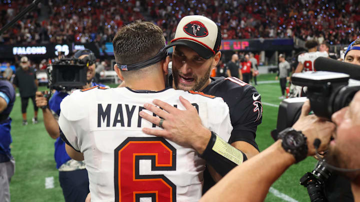Oct 3, 2024; Atlanta, Georgia, USA; Atlanta Falcons quarterback Kirk Cousins (18) talks to Tampa Bay Buccaneers quarterback Baker Mayfield (6) after a game at Mercedes-Benz Stadium. Mandatory Credit: Brett Davis-Imagn Images
