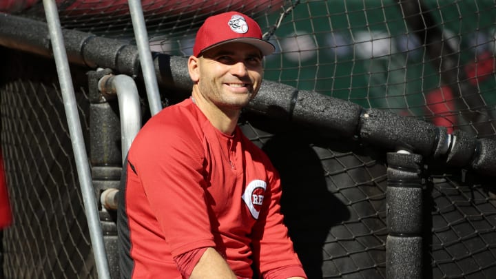 Cincinnati Reds first baseman Joey Votto (19) laughs near the cage during batting practice before the MLB National League game between the Cincinnati Reds and the Chicago Cubs at Great American Ball Park in downtown Cincinnati, on Friday, April 21, 2017.