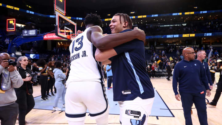 Nov 29, 2023; Memphis, Tennessee, USA; Memphis Grizzlies forward Kenneth Lofton Jr. (center, right) celebrates with forward-center Jaren Jackson Jr. (13) after defeating the Utah Jazz at FedExForum. 