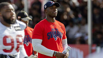 Houston Texans head coach DeMeco Ryans watches players warm up during training camp practice at the Houston Methodist Training Center.